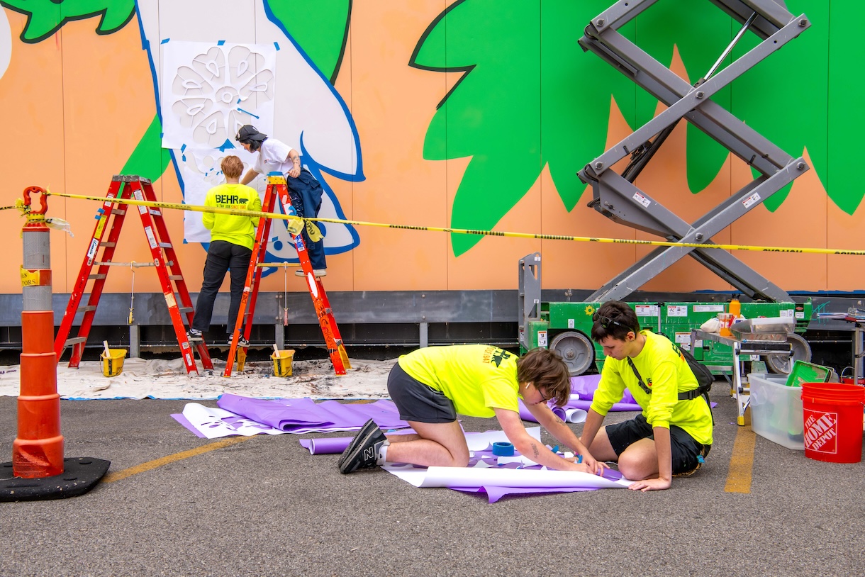 Students working on the "Curious Bunny" mural on the Student Center.