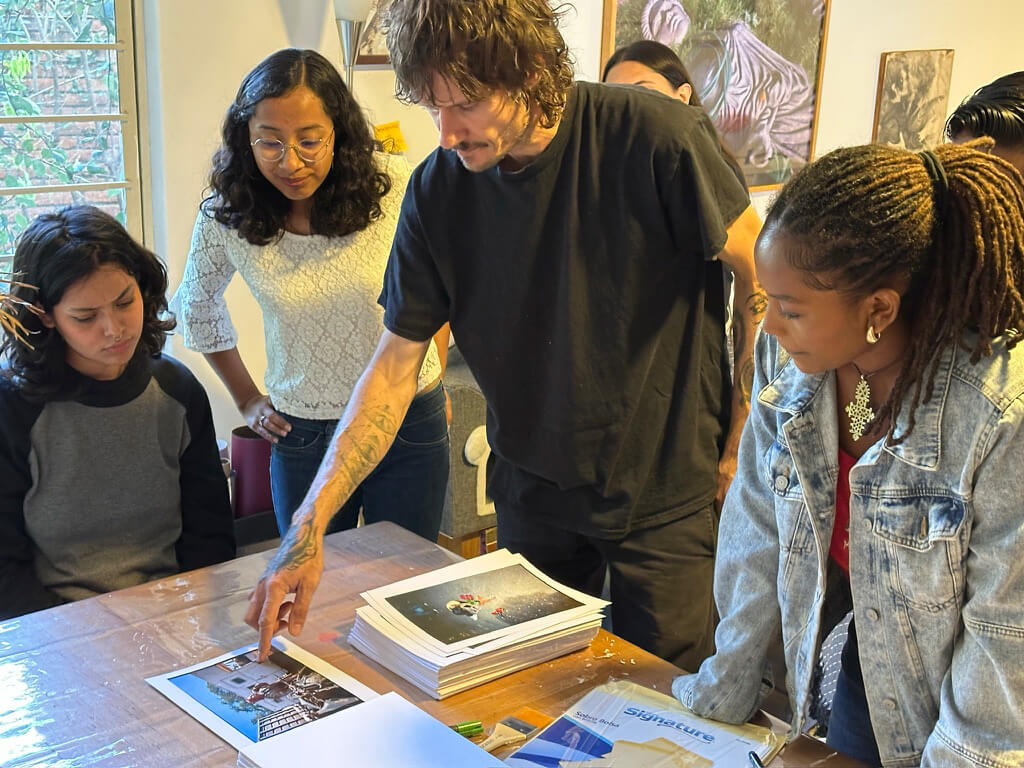 Fellow Alessandro Bo selecting images for publication with Columbia students and Oaxacan emerging photographers.