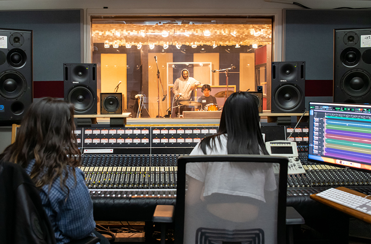 Audio Arts Students work in a state of the art lab with a faculty member.