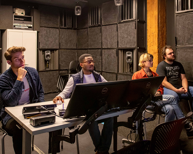 Students in the Audio Arts Degree Program work on equipment