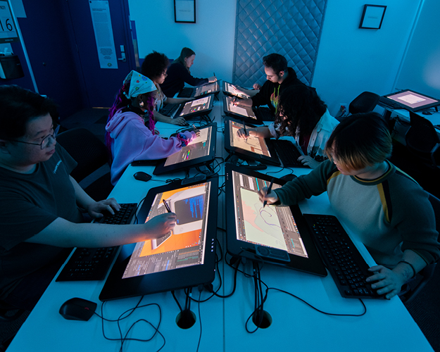 3d animation degree students drawing on computer screens