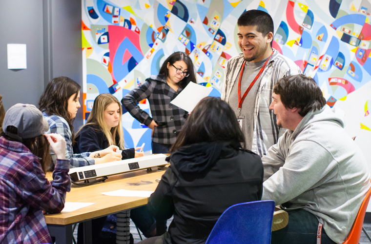 students work together around a table