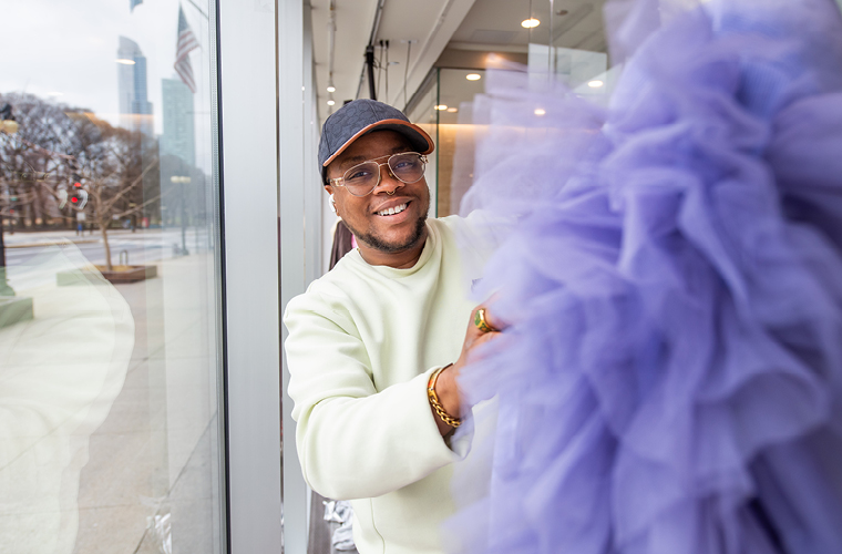 fashion studies student dress a mannequin in a window