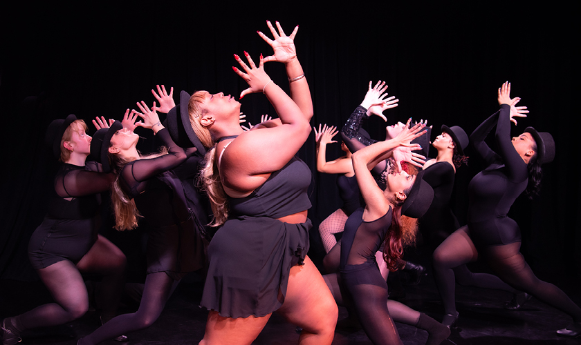 musical theatre performers on stage