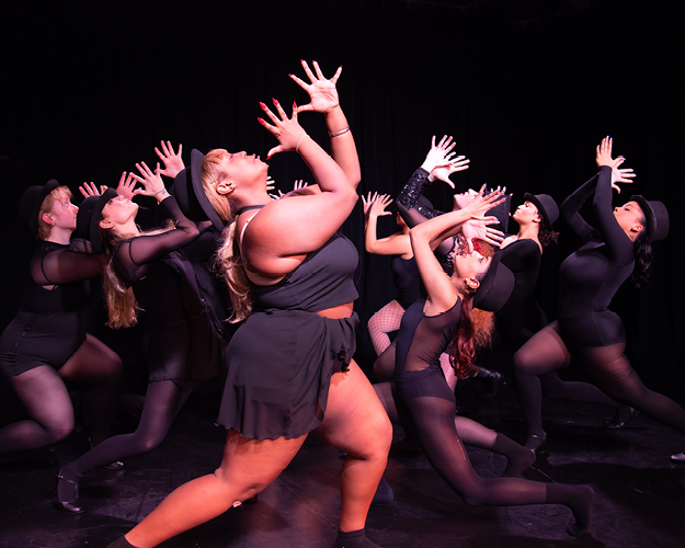 musical theatre performers on stage