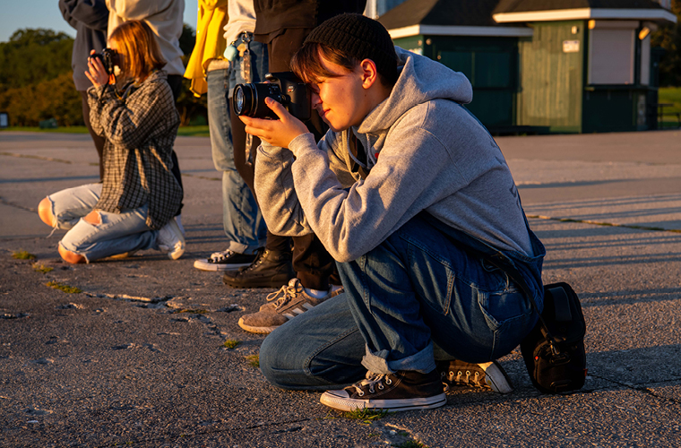 Two students taking photographs