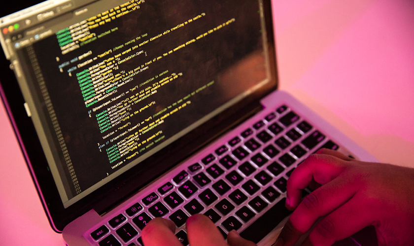 Programming student working at a computer