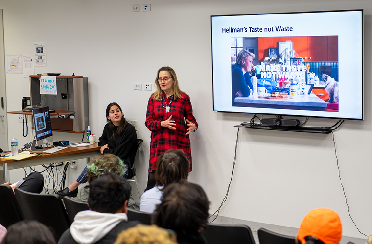 a masters in strategic communication student presents to a class of peers