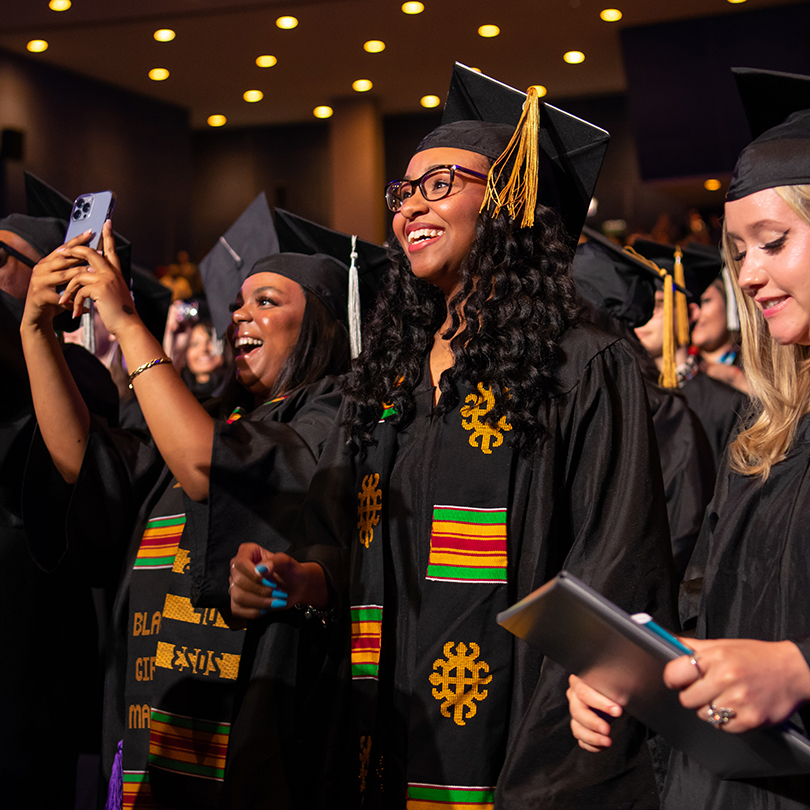 students cheering at commencement