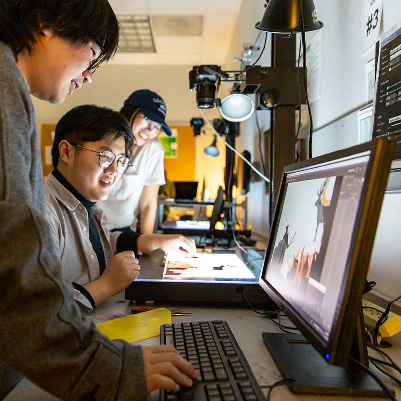 students working a computers in design lab