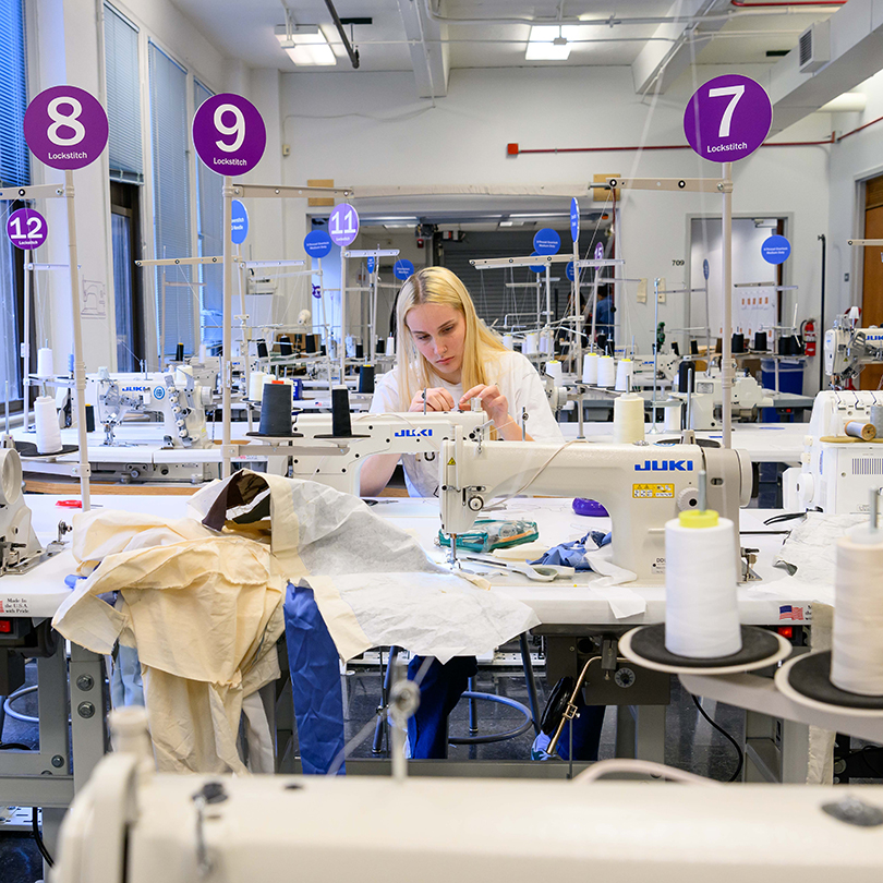 student working at sewing machine