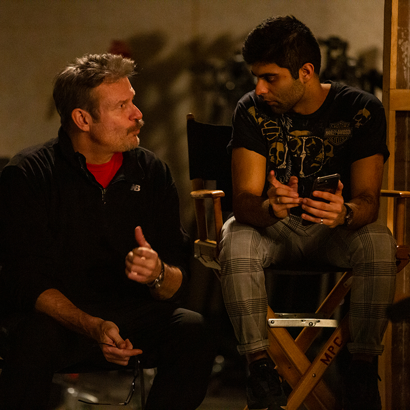 students and faculty having discussion on film set