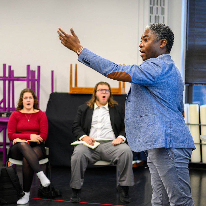 theatre faculty  member leading students in class