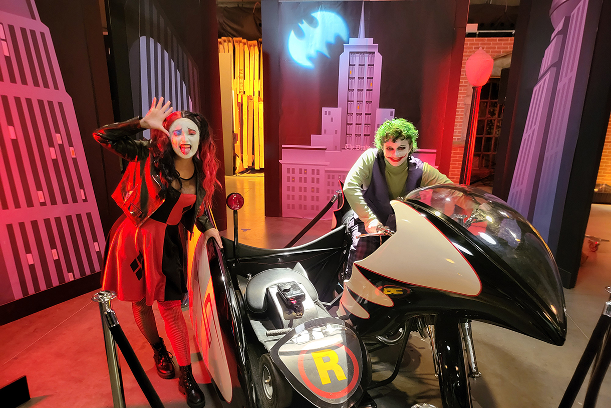 students dressed up like harley quinn and the joker on the bat motorycle