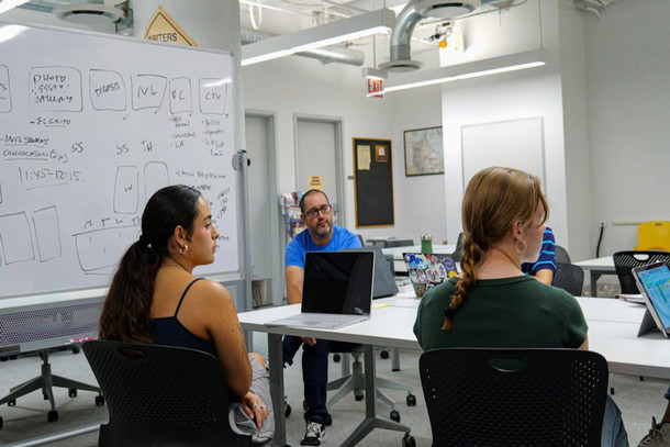 The Columbia Chronicle Faculty Advisor with Students in a Meeting