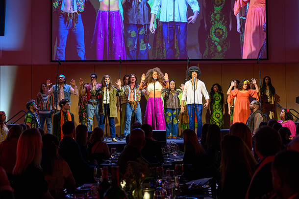 students from play hair perform on stage