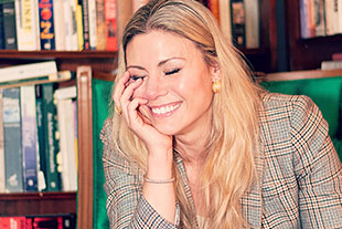 photo of michelle brady with bookcase background