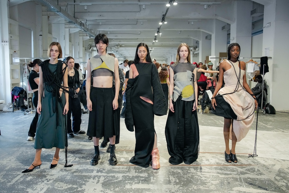 Five models appear in a fittings lineup wearing the “Remembering the Legacy of Chicago Bauhaus” collection by Rae Breazeale, BFA Fashion Design ’25. Photo by Gianluca Carraro