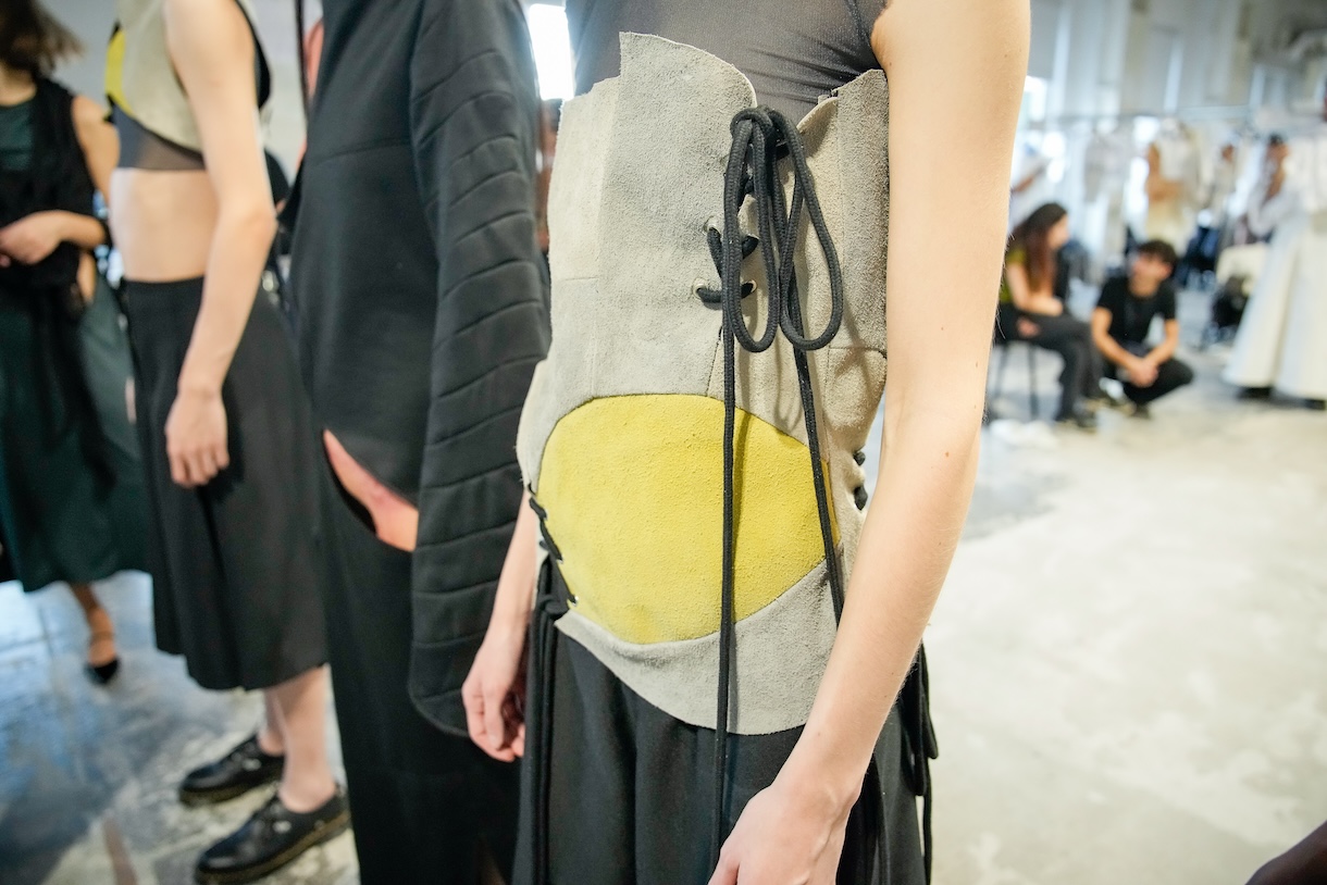 Close up detail of a leather corset designed by Rae Breazeale for their runway collection, pictured on a model during fittings for the City to City fashion show in Milan, Italy. Photo by Gianluca Carraro