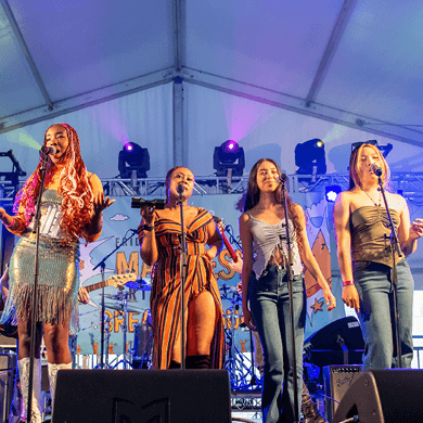 students singing on stage